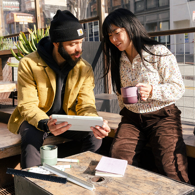 12oz-rise-mug-u7 12oz_rise_coffee_mug_dusty_orchid_couple_city_patio_square.jpg