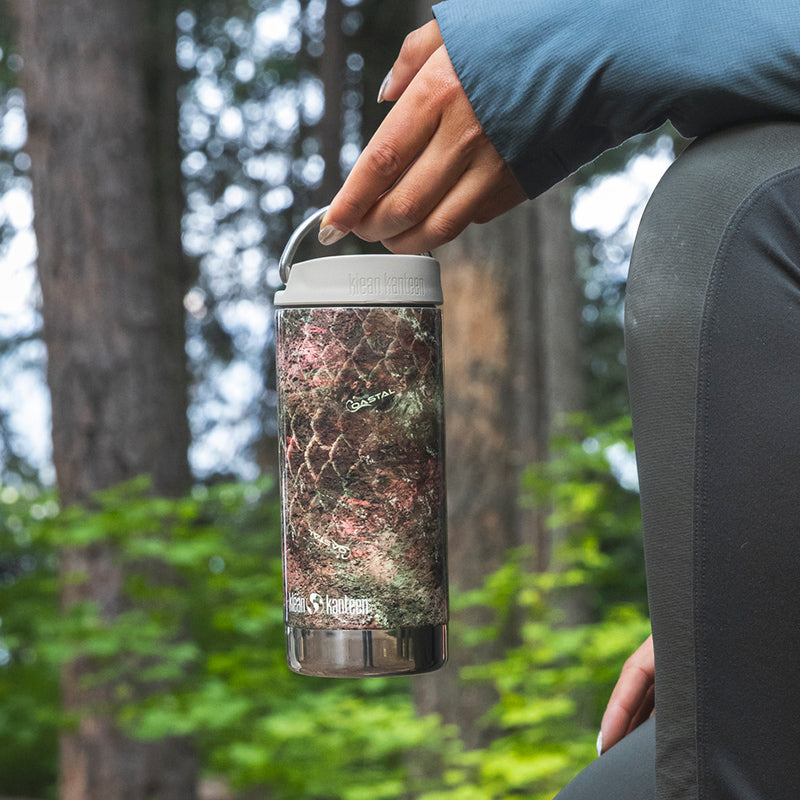 12oz-tkwide-with-twist-cap-mossy-oak-n6 12oz_tumbler_mossyoak_rainbowtrout_hand_closeup_square.jpg