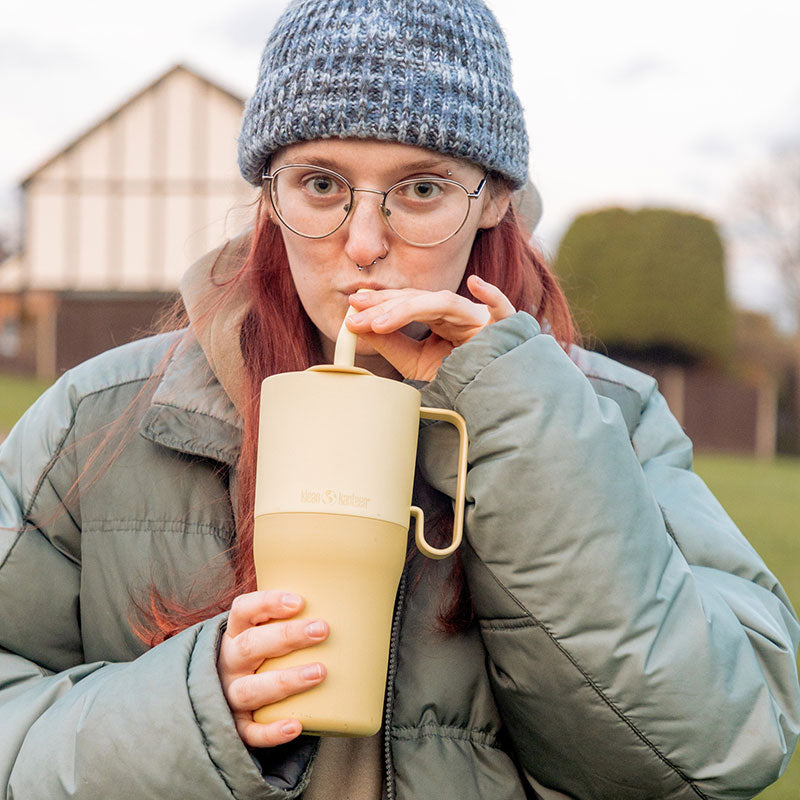 26oz-rise-tumbler-with-straw-lid-o8 26oz_rise_rumbler_straw_wax_yellow_woman_sip_square.jpg