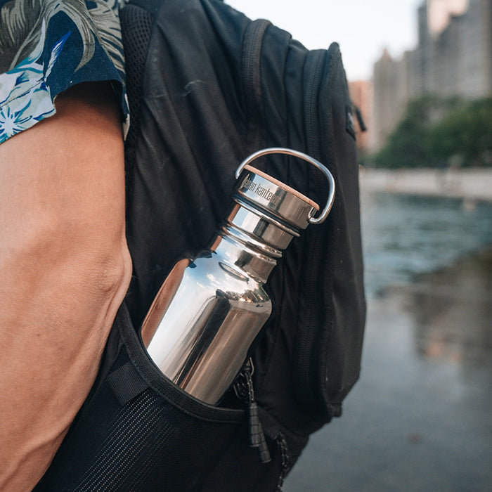 27oz-reflect-with-bamboo-cap-l6 K27SSLRF-MS-BAMBOO_reflect-bottle_backpack_lifestyle.jpg